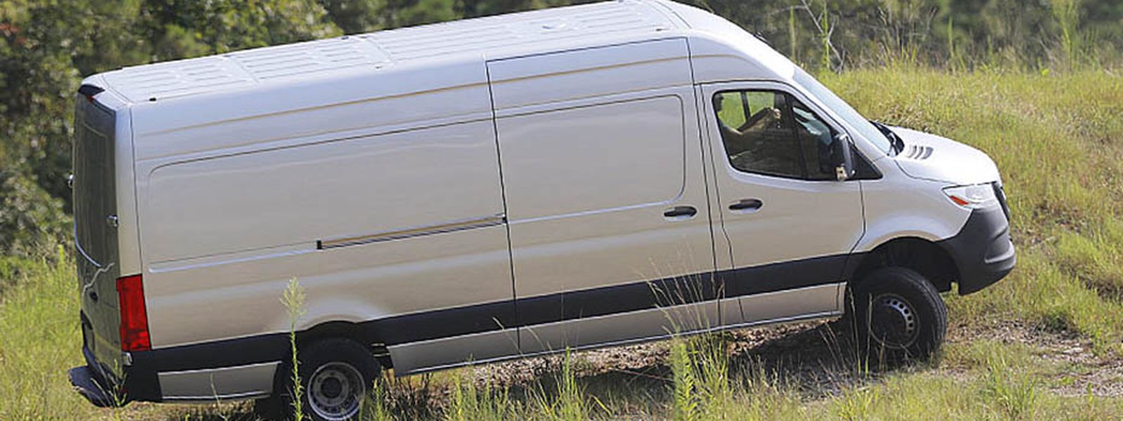 Mercedes-Benz Sprinter high-roof cargo van on rough ground off the pavement